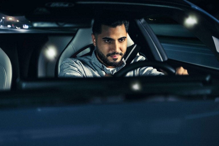 Person sitting in the driver’s seat of a parked 2024 Ford Mustang® coupe | LUV Ford in Henryetta OK